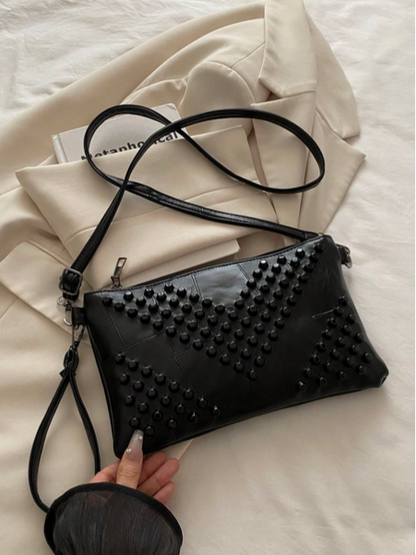 BOLSO NEGRO CON TACHES NEGROS