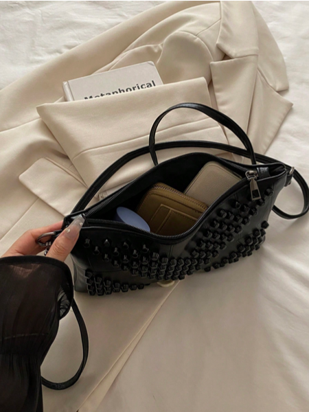 BOLSO NEGRO CON TACHES NEGROS