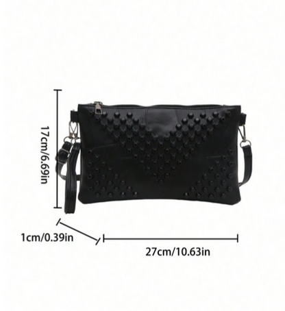 BOLSO DE MANO CON TACHES NEGROS