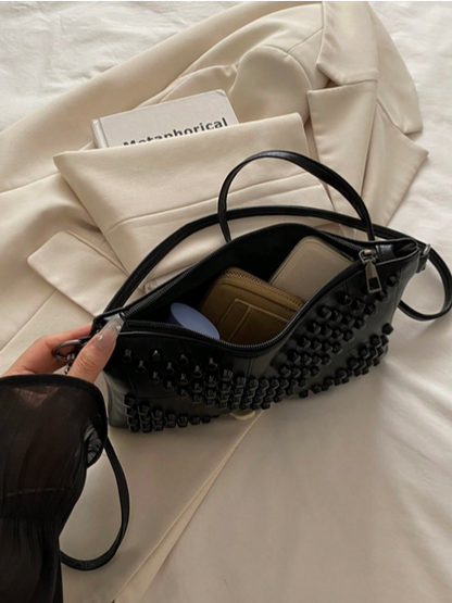 BOLSO DE MANO CON TACHES NEGROS