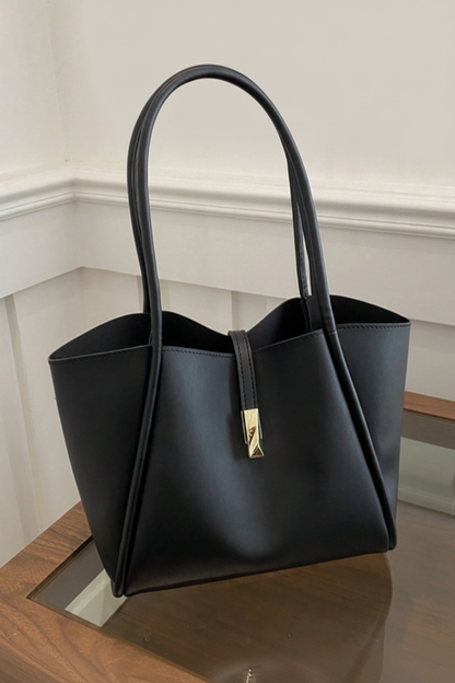 BOLSO NEGRO BROCHE DORADO