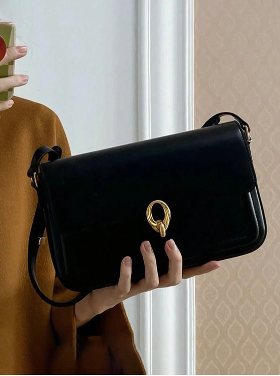 BOLSO NEGRO BROCHE DORADO REDONDO