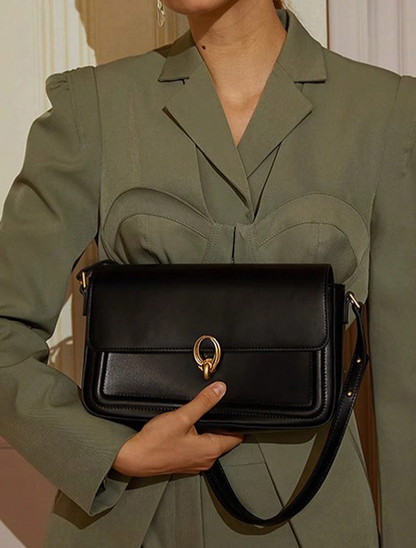 BOLSO NEGRO BROCHE DORADO REDONDO